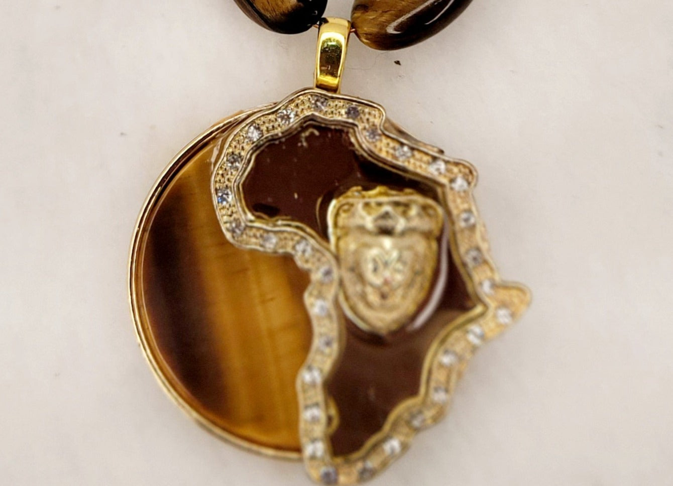 Authentic Tiger's eye African continent circle pendant with tiger's eye flat oval bead necklace.