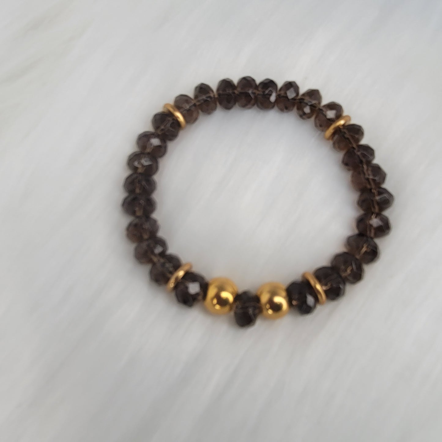 Authentic Smokey Quartz faceted and stainless-steel bead with brass spacers bracelet.