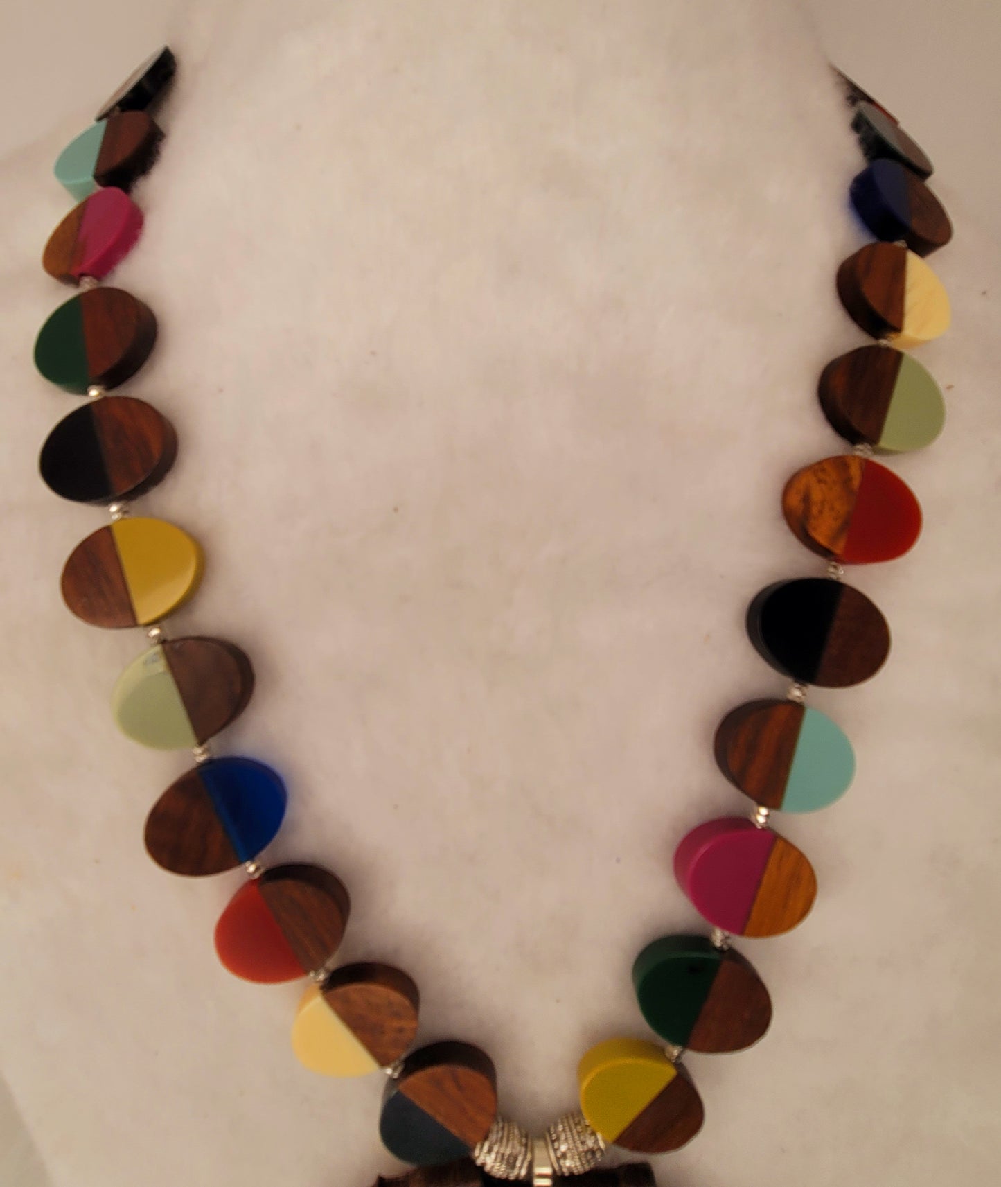 Large wood African Pendant with multi-colored wood and resin necklace with silver tone accent beads.