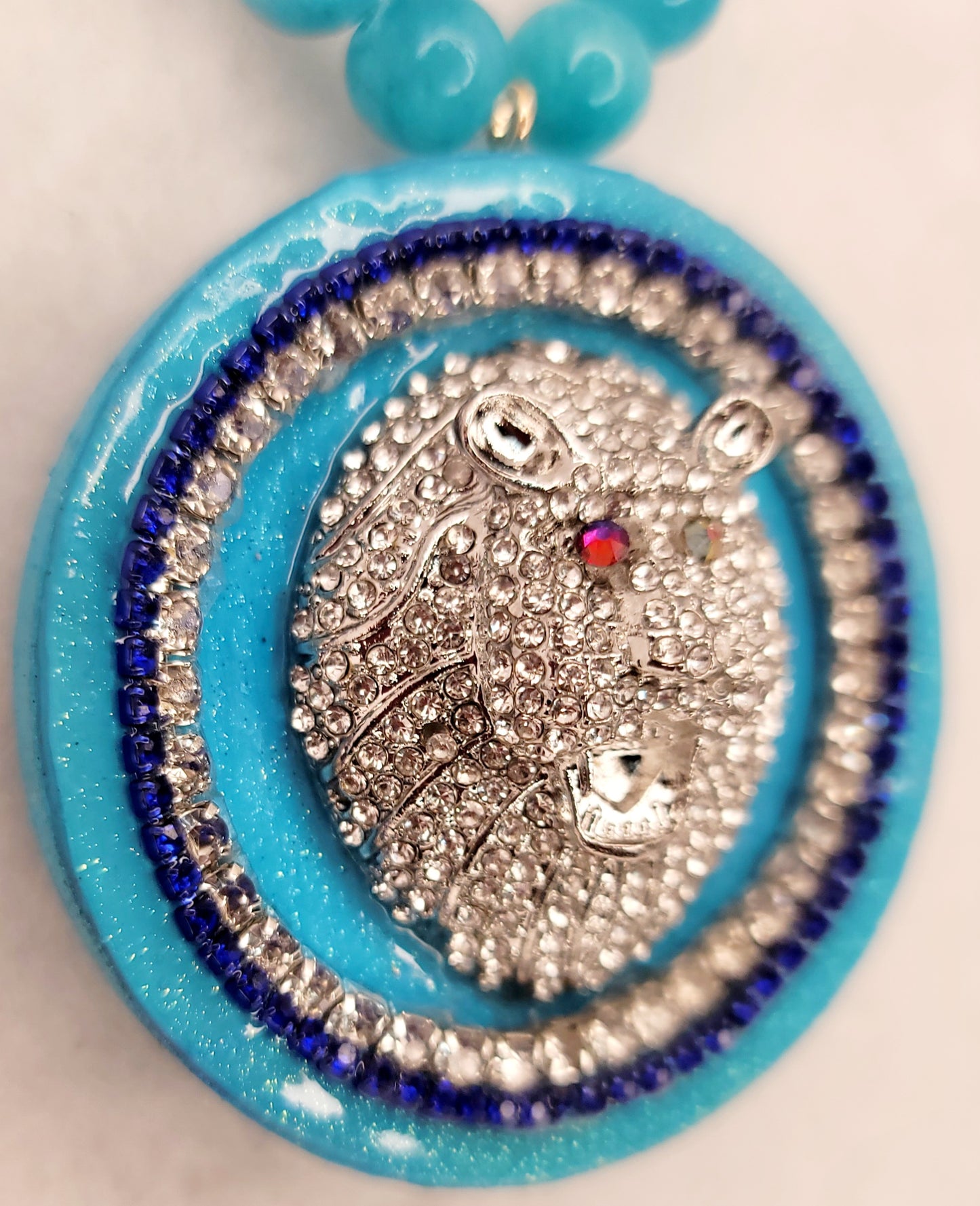 Rhinestone silver plated lion head circle pendant with Aquamarine necklace.