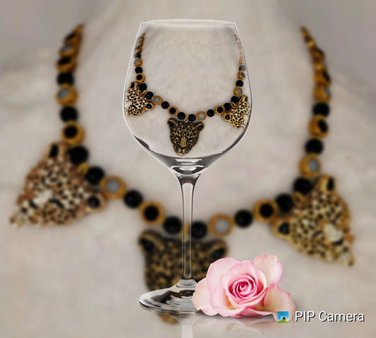 Tri-pendant leopard heads necklace with stainless-steel clasp.